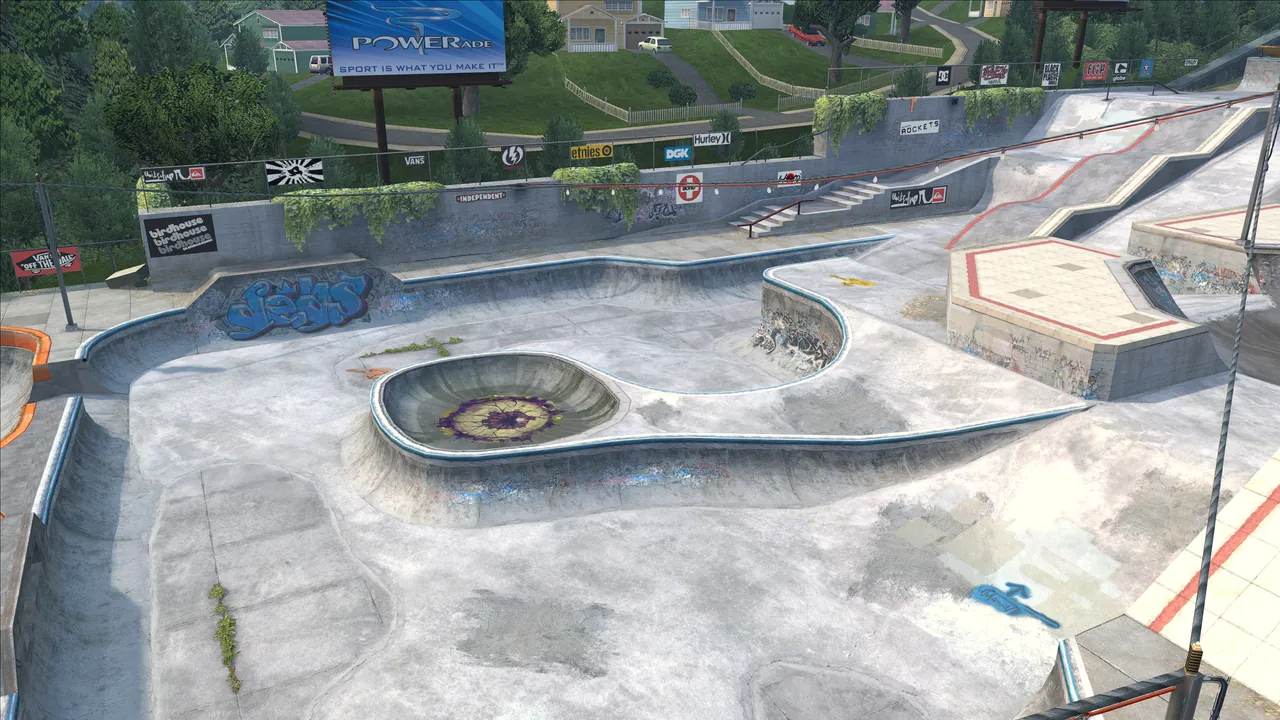 Cretepark seen from high above: bowls, ramps and the city behind